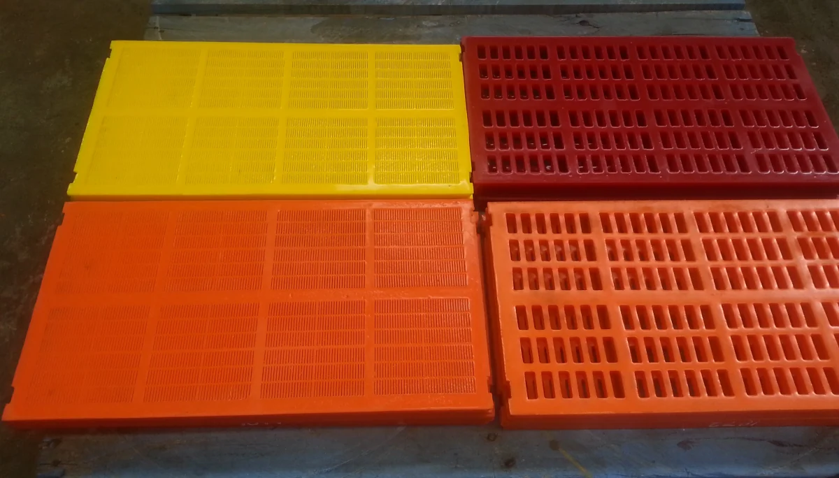 Four OXY-PRO® screen panels in different colours, showing square and slotted aperture patterns