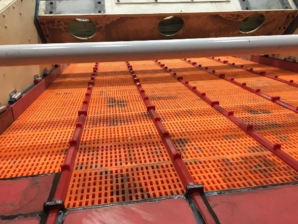 A vibrating screen deck fully fitted with OXY-PRO® panels and stringer bar covers
