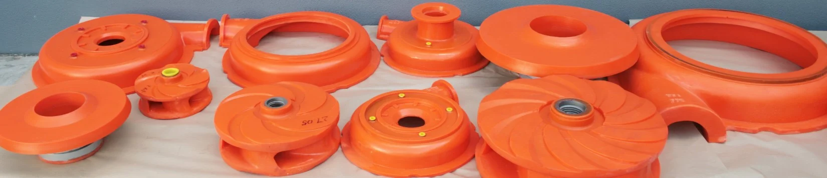 A row of OXY-PRO® moulded pump wet-end liners, impellers and cover plates